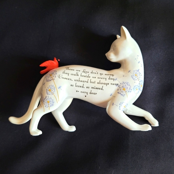 White Cat Looking Back at a Red Bird That Had Landed on His Back - Picture 6 of 12